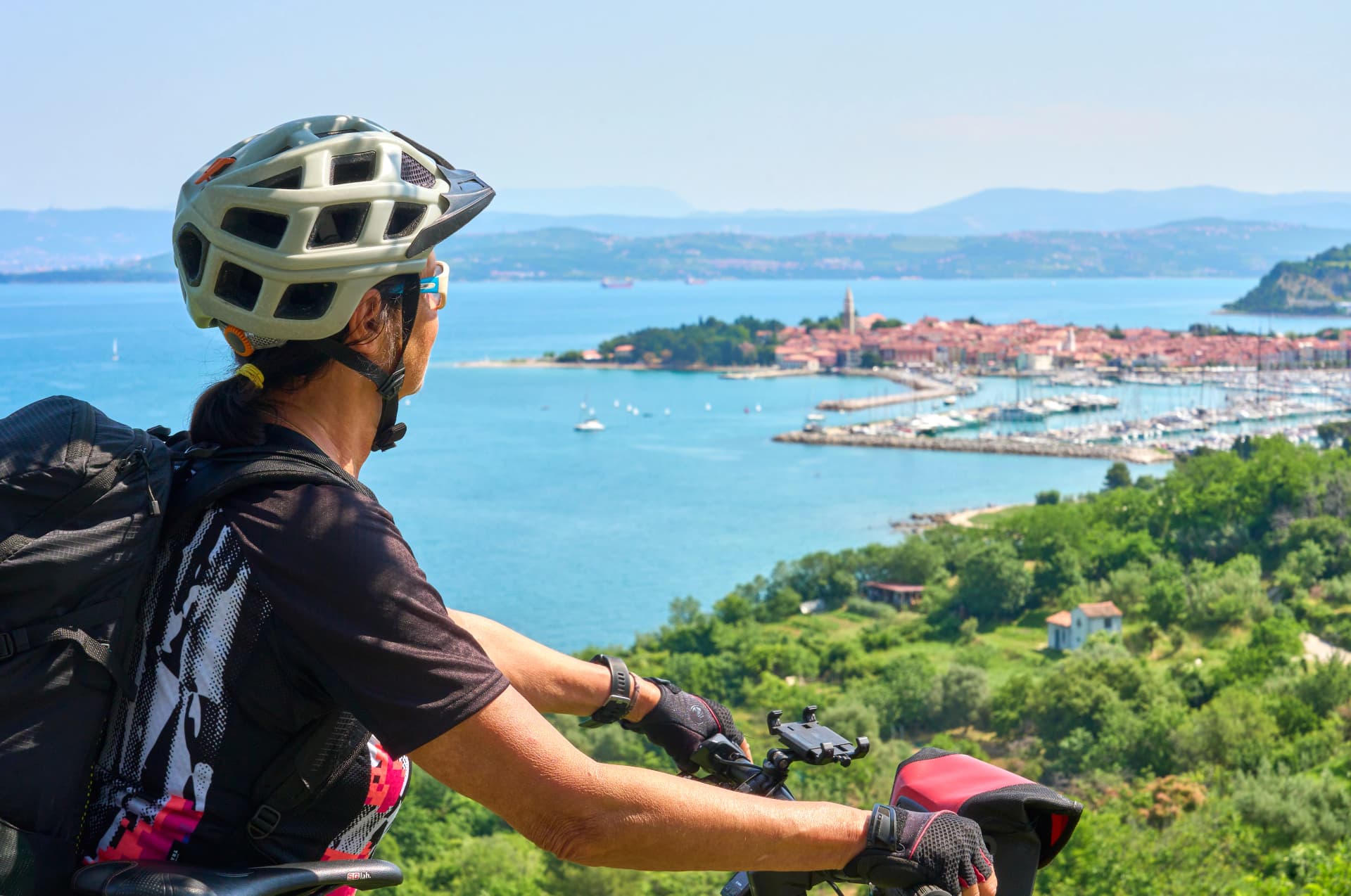 nice active senior woman on a mountain bike tour at the Slovenian Mediterranen cost above Izola