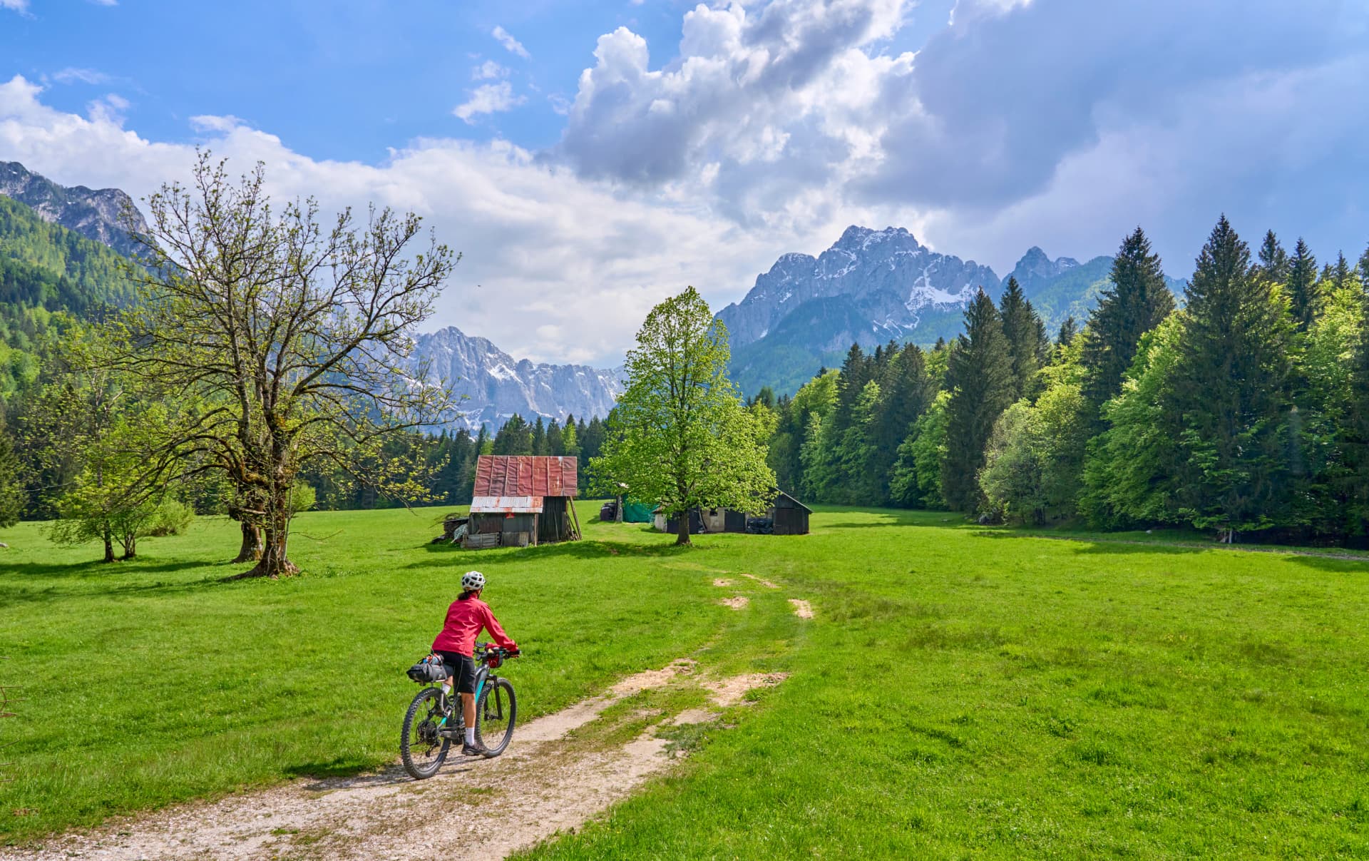active senior woman on a mountain bike tour in the Julian Alps above Kranska Gora in Slovenia