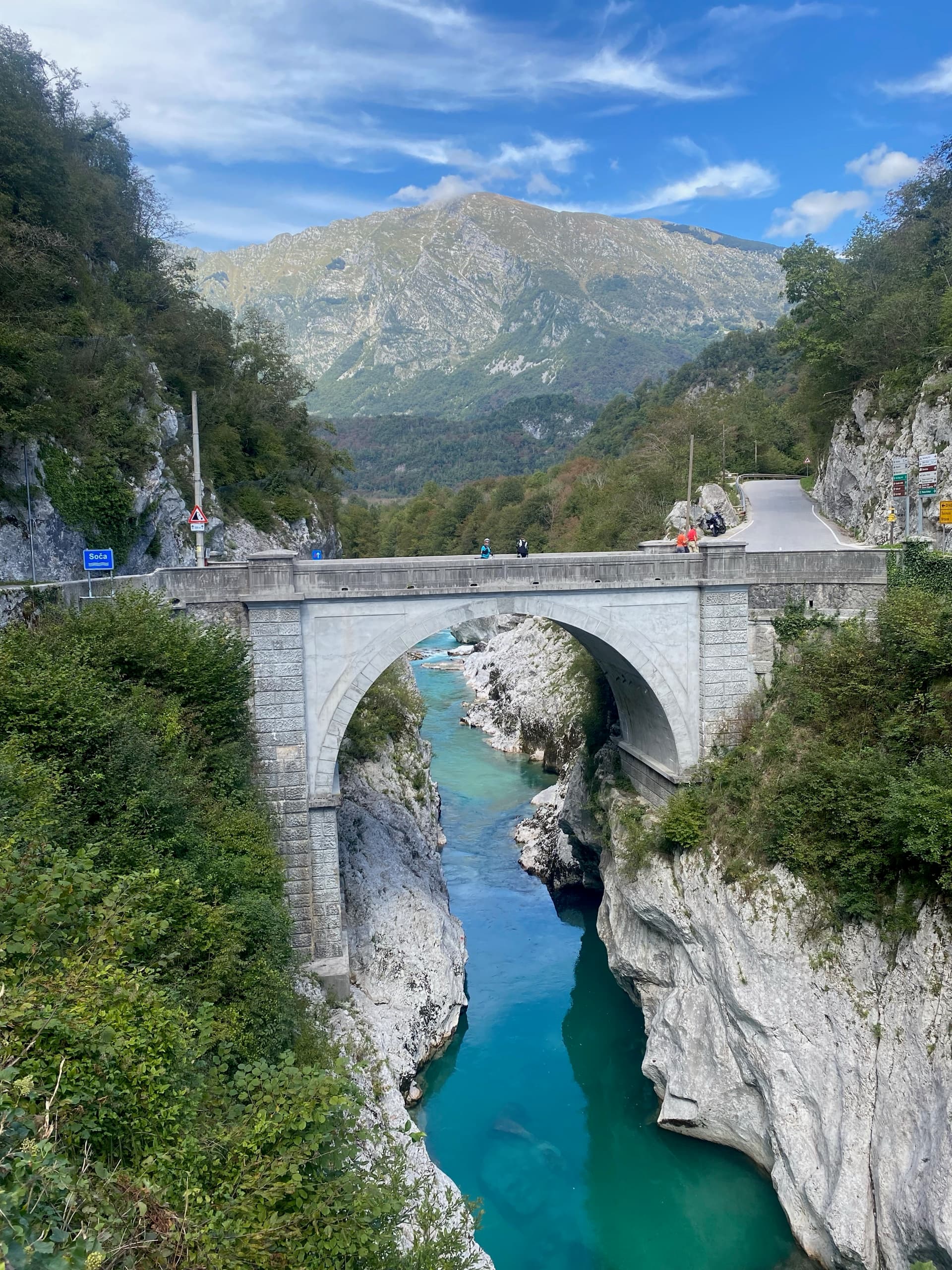 Napoleon Bridge over the turquoise Soca River gorge with mountain backdrop