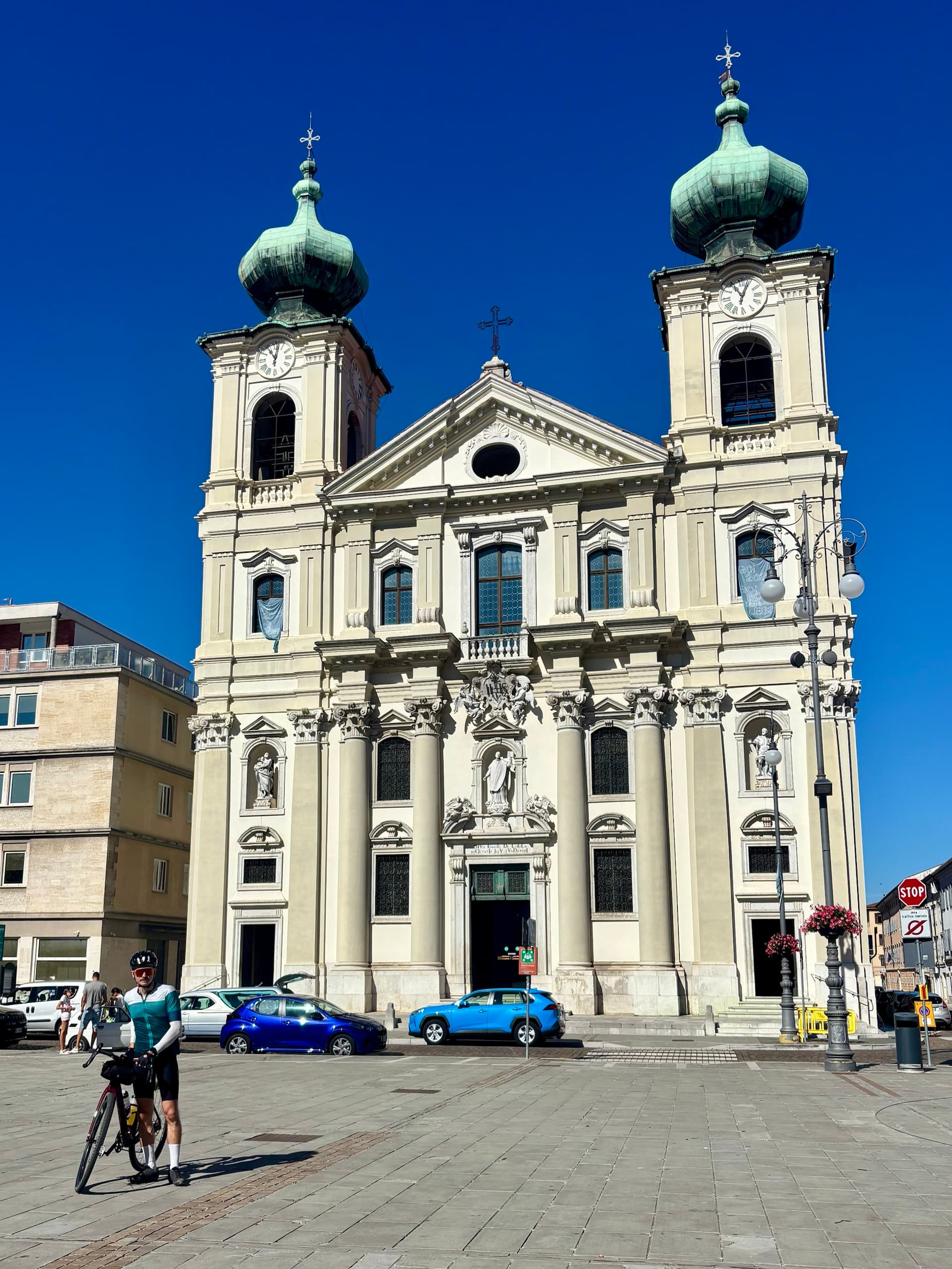 Cyclist in front of Sant Ignazio Church in Gorizia