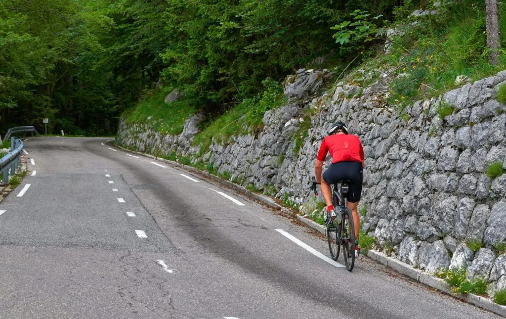 cycling along vrsic mountain pass slovenia stockpack adobe stock scaled