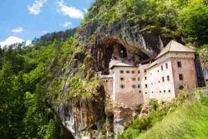 Take time to visit iconic landmarks like Predjama Castle